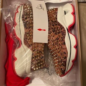 Christian Louboutin sneakers size 36. Worn once just sitting in my closet.